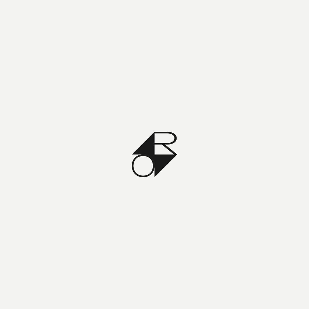 Minimalist black geometric logo on a white background, featuring abstract shapes resembling an R and an O, conveying simplicity and modernity.